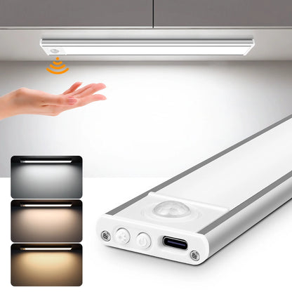 Motion-Sensor Cabinet Light under a cabinet, lighting up as a hand reaches in