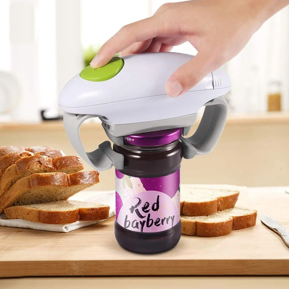 Hands-free electric jar opener on a jam jar, one hand pressing the button
